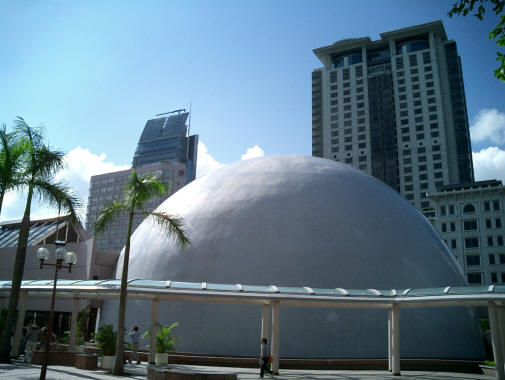 Dome of the Hong Kong Space Museum with tower of the Peninsula Hotel in the background, near the southern end of Nathan Road